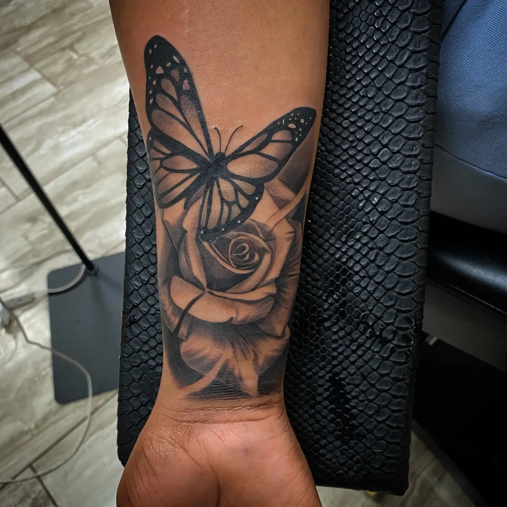 # Butterfly Resting on Rose Tattoo