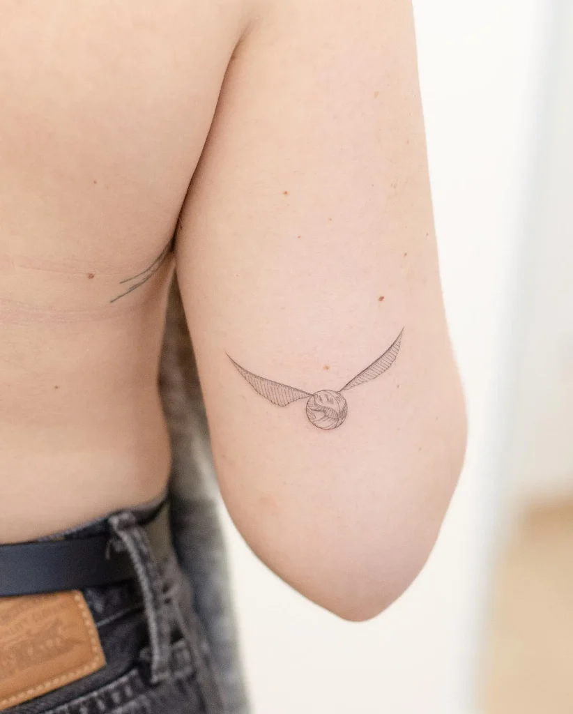 ### Elegant Golden Snitch Tattoo