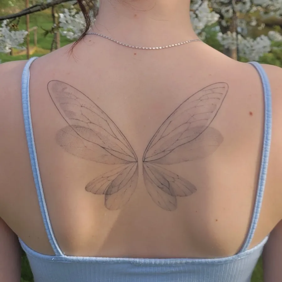 **Delicate Fairy Wings Tattoo**