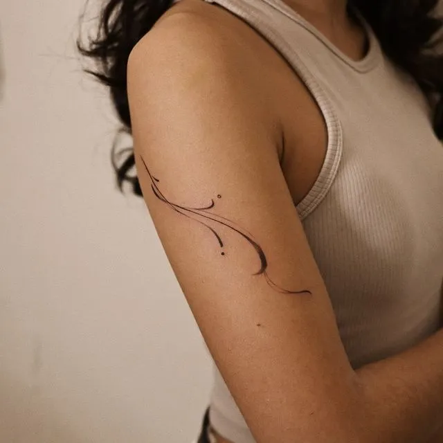 **Flowing Ocean Wave Tattoo**