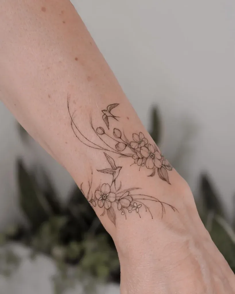 ### Hummingbird and Blossoms Tattoo