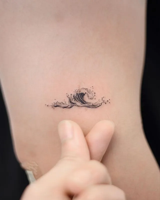 **Simple Ocean Wave Tattoo**