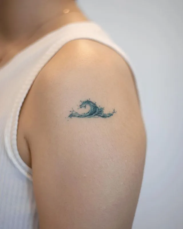 ### Tiny Ocean Wave Tattoo